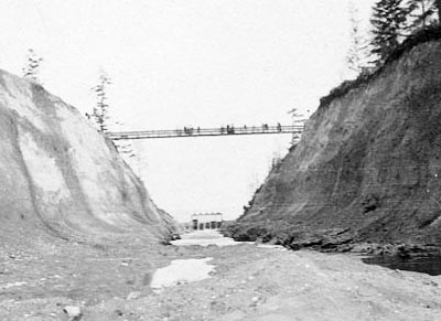 Looking west toward the Montlake Cut with footbridge crossing, ca. 1911.