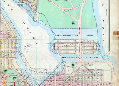 All three of the proposed routes for the canal across the Montlake isthmus appear on this 1912 Baist real estate map. The southernmost, known as Pike’s Canal Reserve and marked with a “21” on this map, was platted in 1869. The Government Ship Canal, also known as the Canal Reserve, was condemned by the King County commissioners in 1898 and transferred to the federal government for the Lake Washington Ship Canal. Before construction began, the Lake Washington Canal n this map was chosen by the Army Corps of Engineers because of its straighter alignment with the route of the shipping channel in Portage Bay. Courtesy Paul Dorpat. 